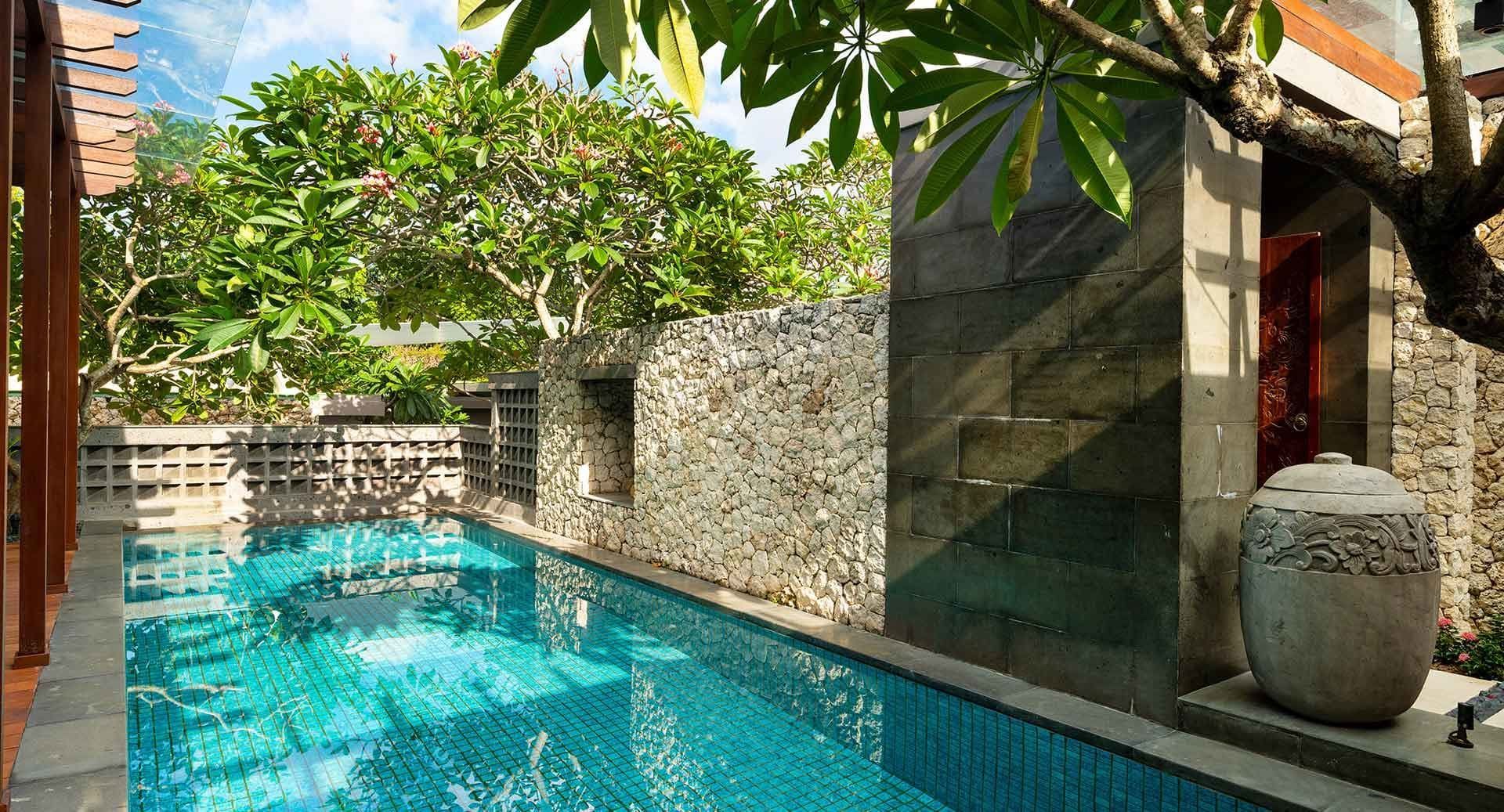 The spa pool beside a wall of hand-laid stone